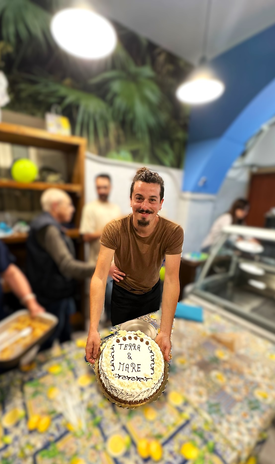 Davide holding a cake